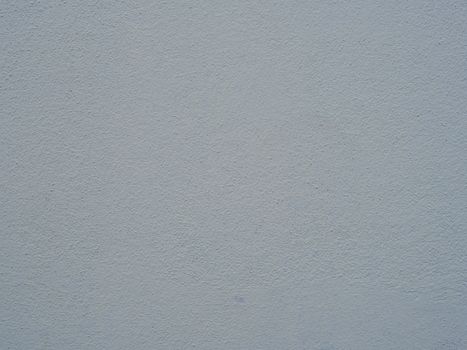 Close-up view of a blue textured wall surface providing abstract background.