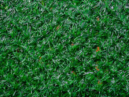 Free Vibrant close-up image of synthetic green grass, perfect for backgrounds. Stock Photo