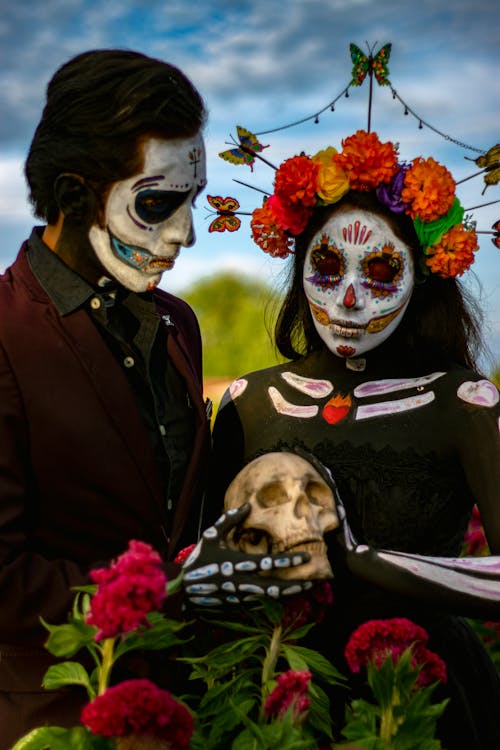 Woman and Man with Painted Face for Dia de Muertos