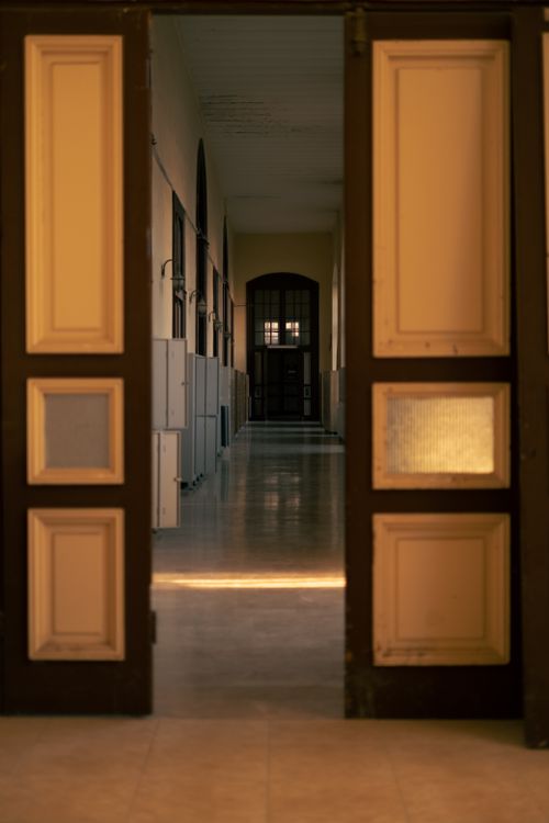 Free An empty corridor with open doors in a historic building in Istanbul, Türkiye. Stock Photo