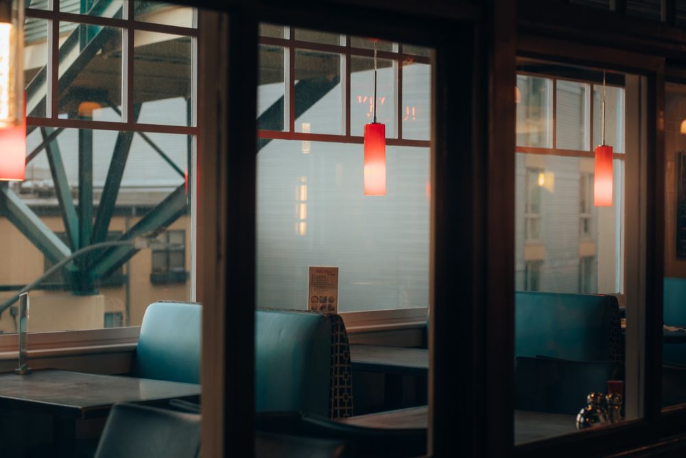 The booths at Slices seen from the street through the front window