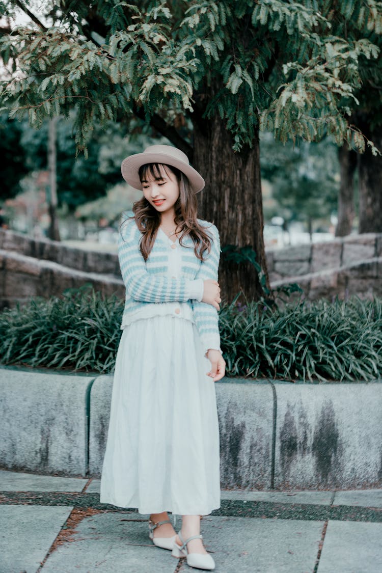 Woman In Dress And Cardigan