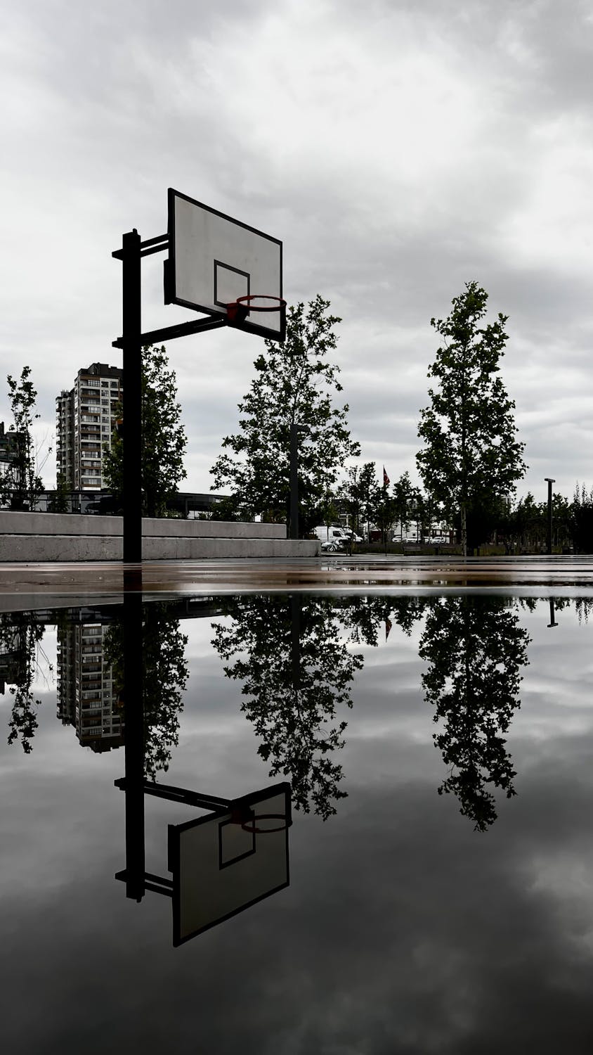Basketball Court with Water on Pavement · Free Stock Photo