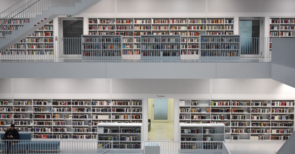 Explore the sleek design of Stuttgart's public library with its expansive bookshelves and minimalist architecture.