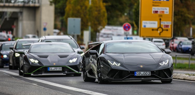 Black Luxury Cars Moving On The Road