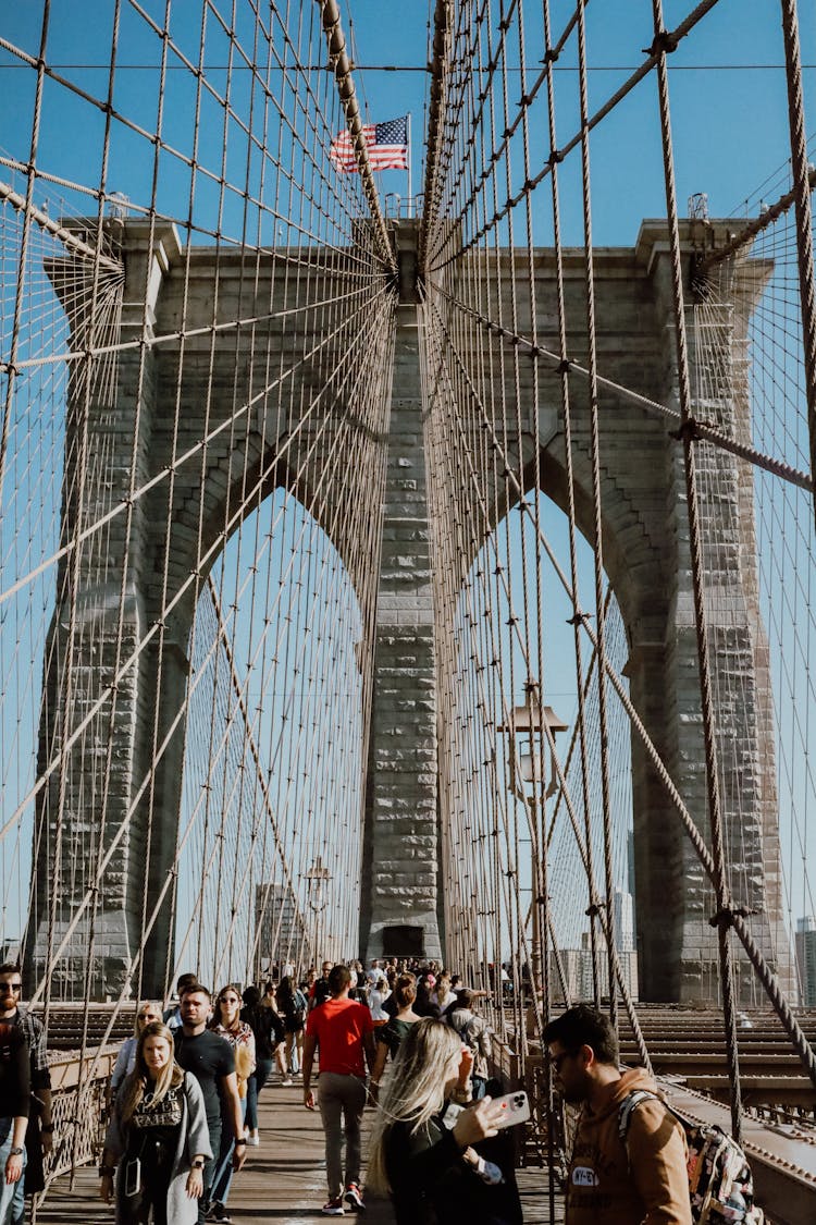 Busy People Walking On Brooklyn Bridge