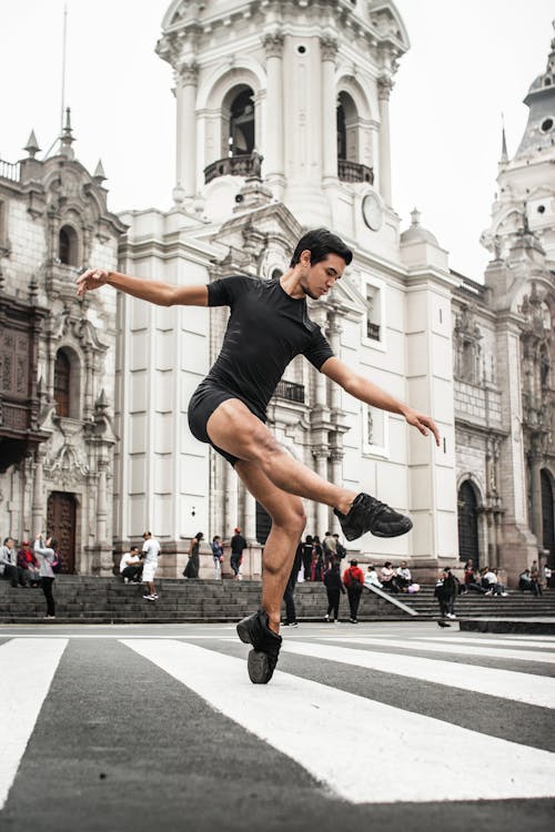 Man Dancing on a Pedestrian Lane