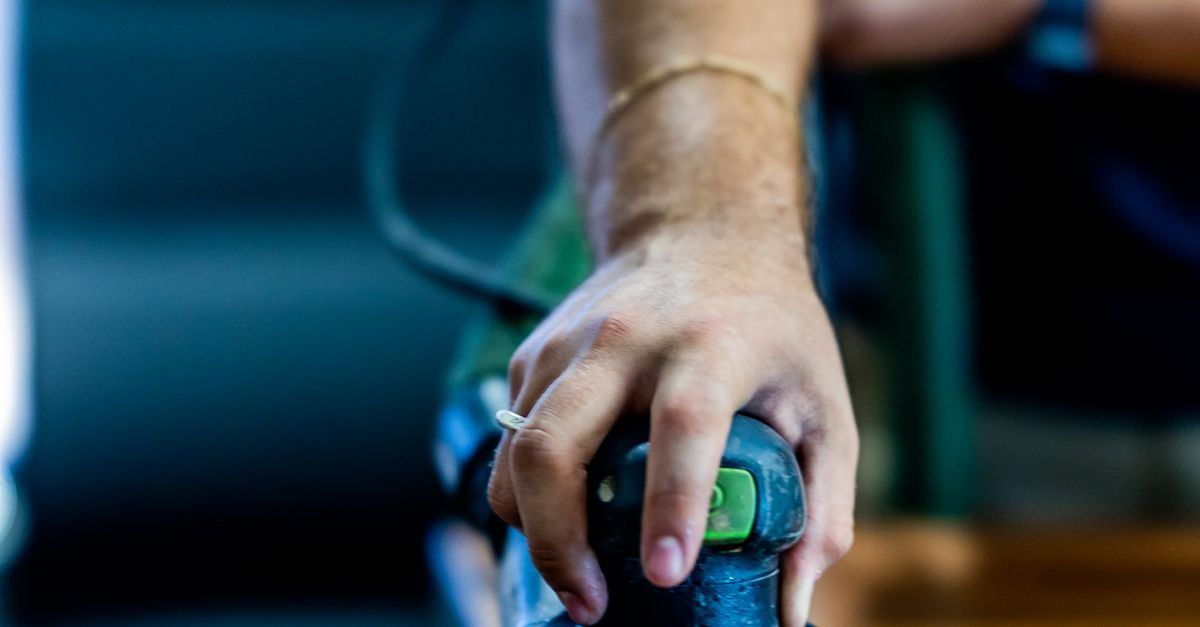 A Person Using a Buffing Machine · Free Stock Photo