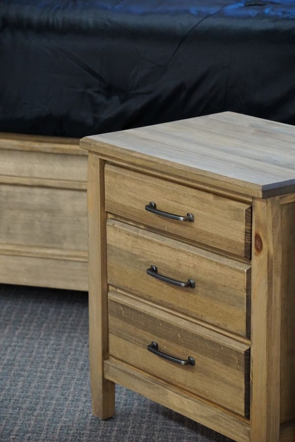 Wooden side table with metal drawer handles — photo by SHAI YYC on Pexels