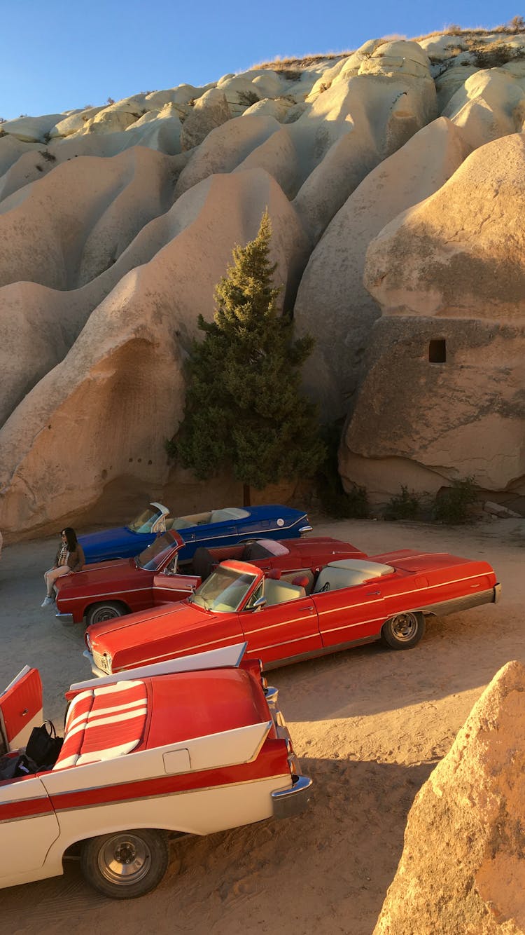 Vintage Muscle Cars Near Rock Formations