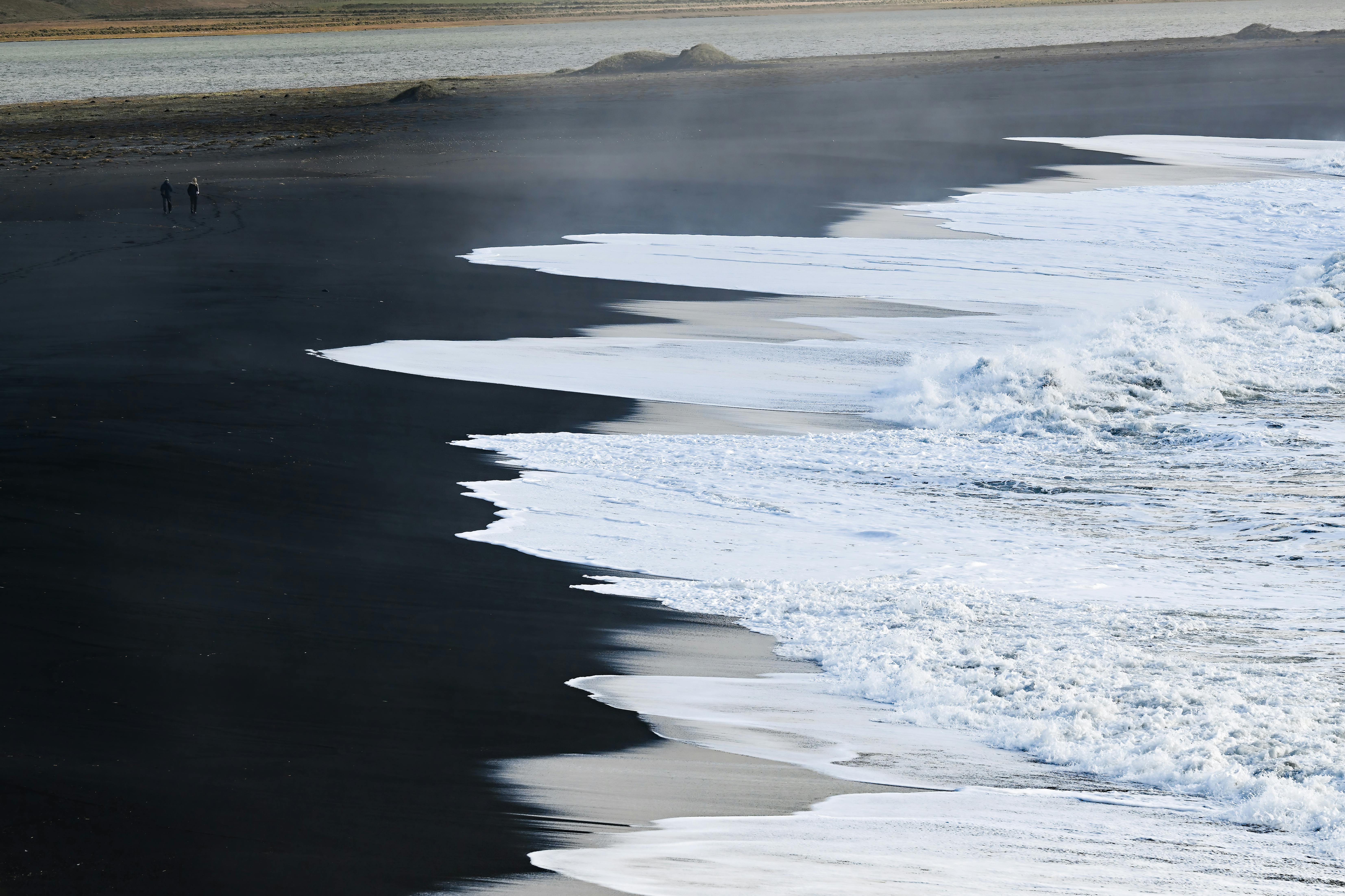 An Ocean Waves On Black Sand Beach · Free Stock Photo