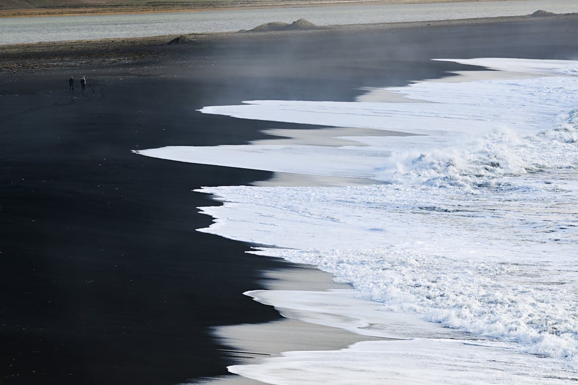 An Ocean Waves on Black Sand Beach