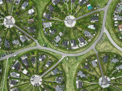 A drone shot showing distinctive circular gardens in Brondby. Green and architectural patterns stand out.