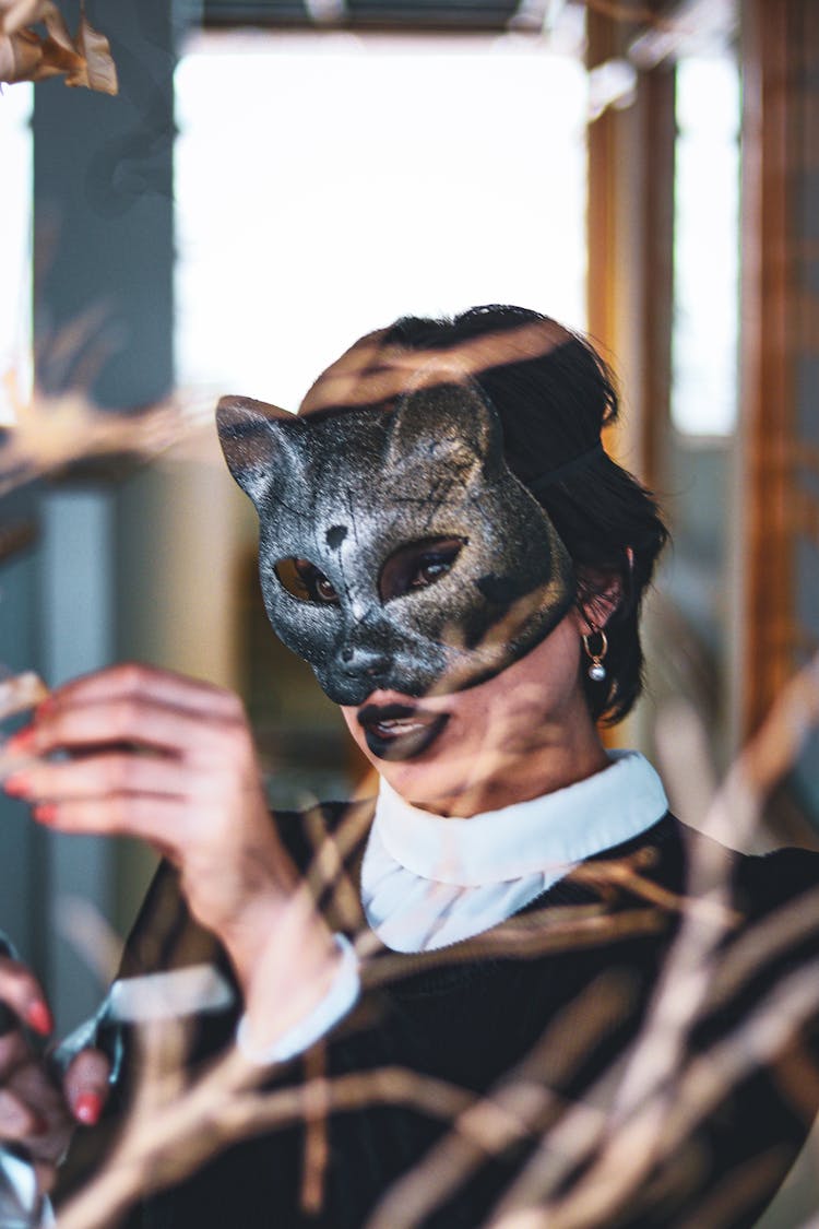 A Person In White And Black Top Wearing Fox Mask During Halloween