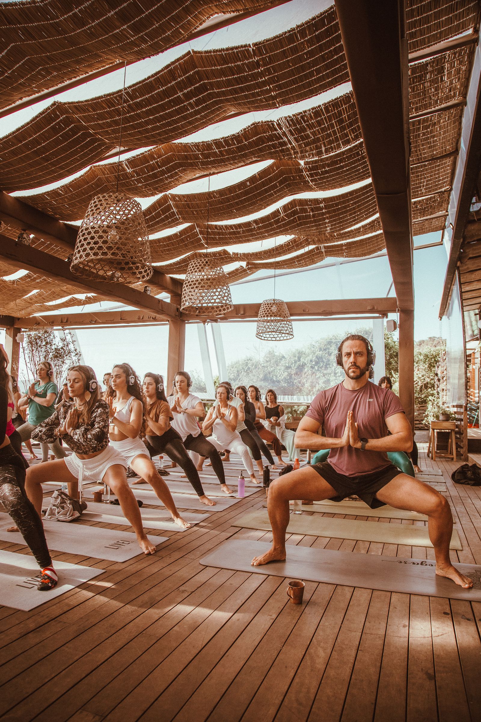 Group yoga practice in warm natural light
