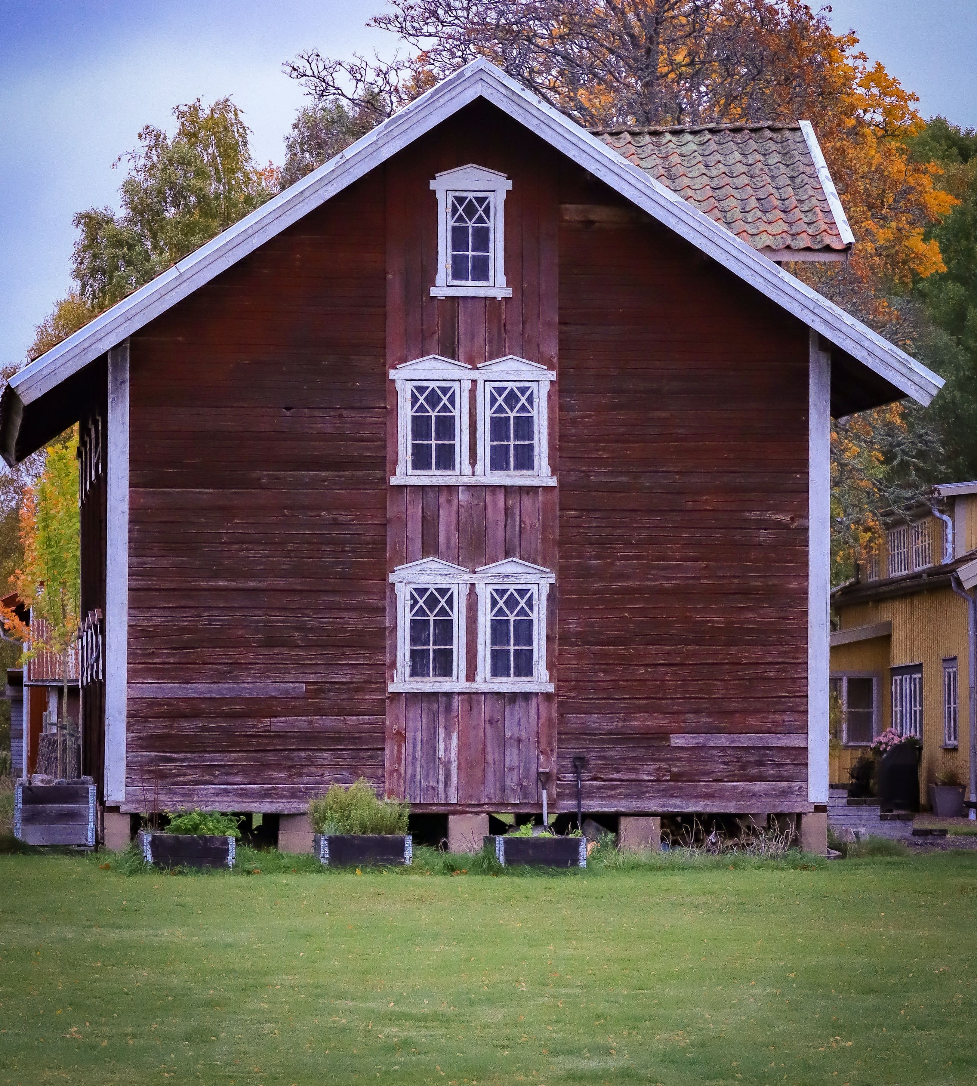 A Wooden House on Green Grass Field · Free Stock Photo