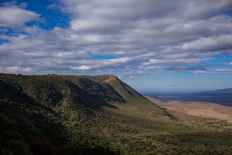 Photo Of Mountain Under Cloudy Sky