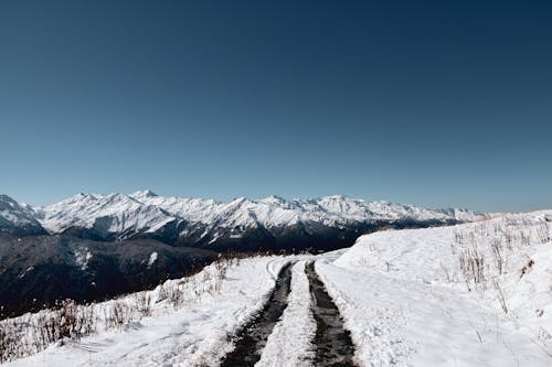 Snow Covered Road Near Mountain