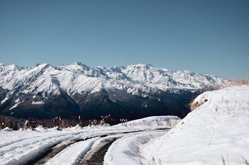 Photo of a Snow Covered Mountain Under Blue Sky