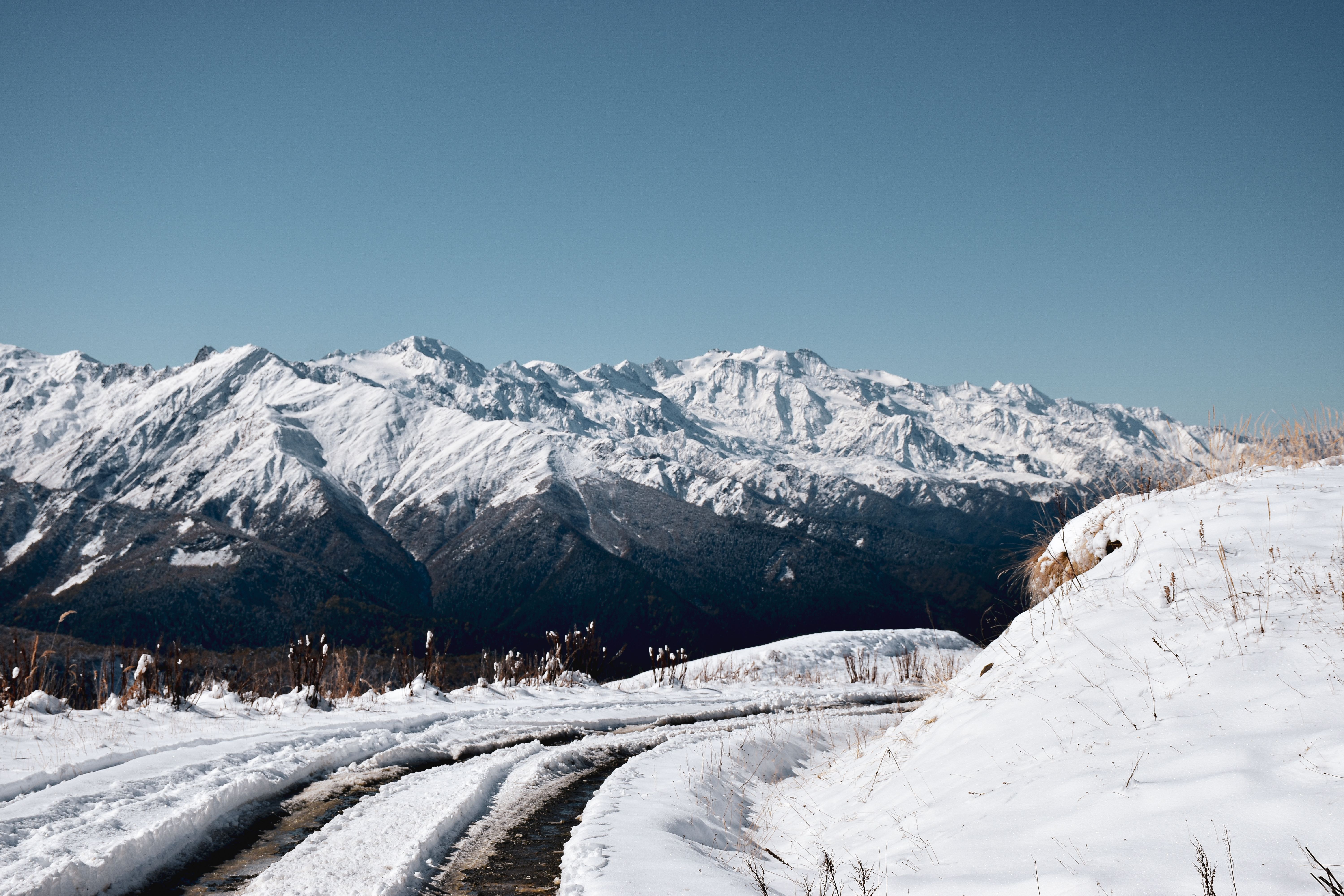 Snow Covered Mountains Under Blue Sky · Free Stock Photo