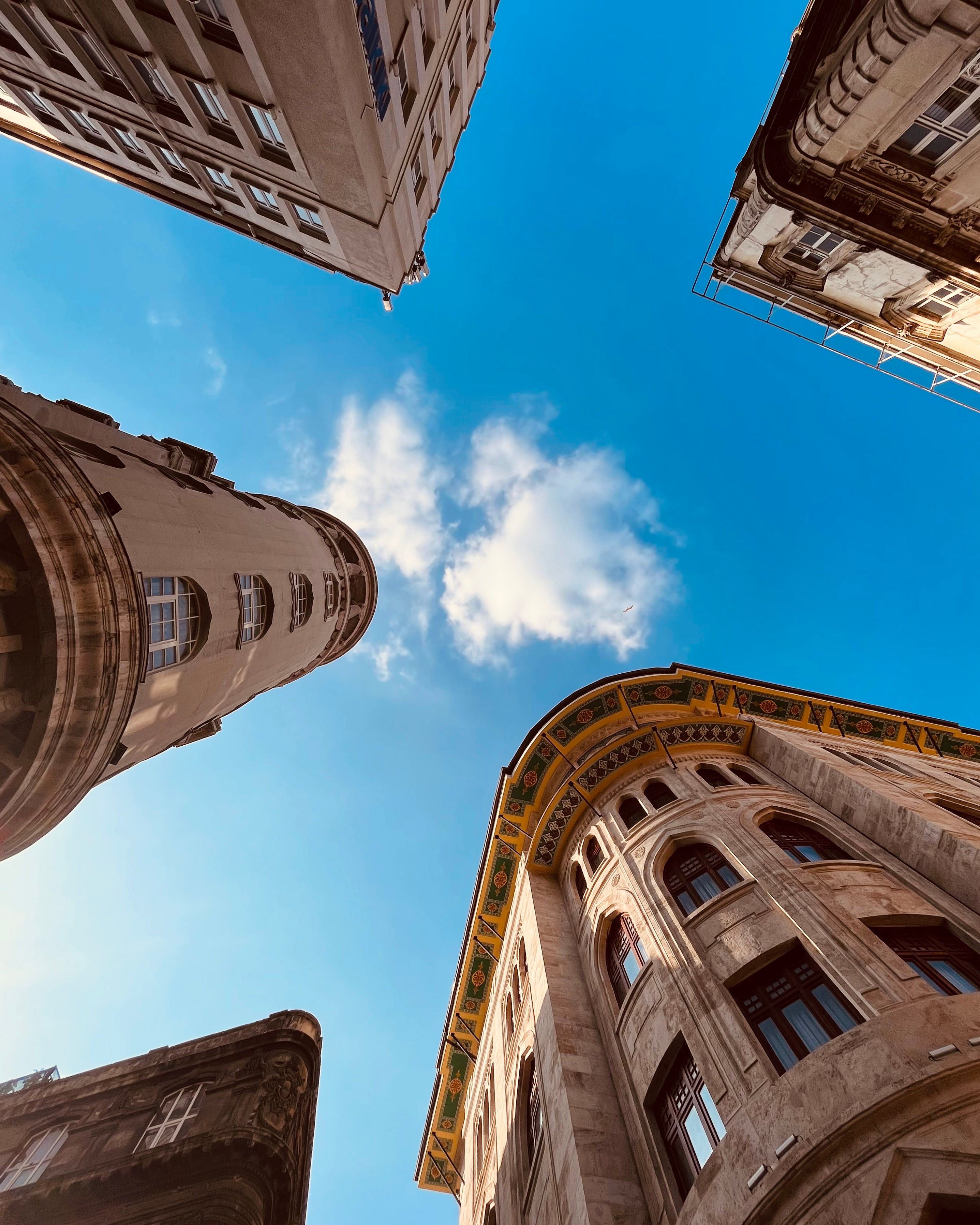 A Low Angle Shot of Concrete Buildings Under the Blue Sky · Free Stock ...