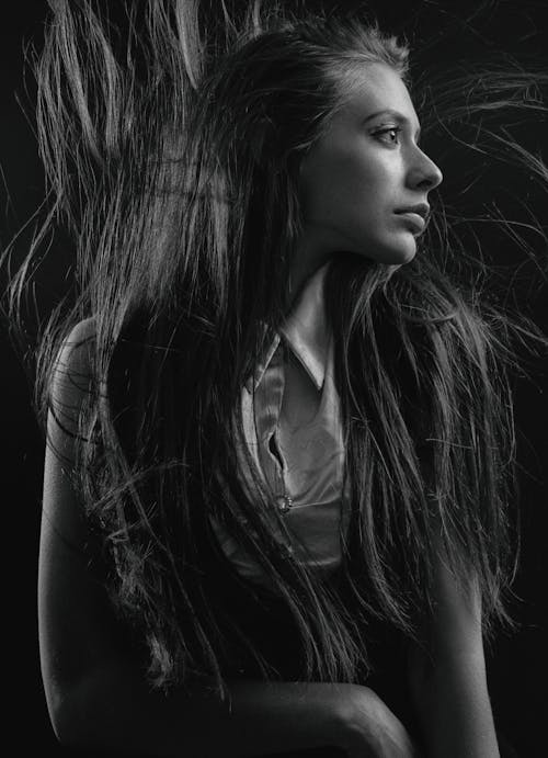 Black and White Profile of a Woman with Tousled Hair