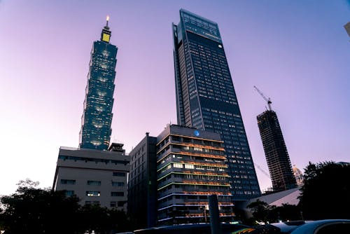 A Low Angle Shot of City Buildings Under the Clear Sky