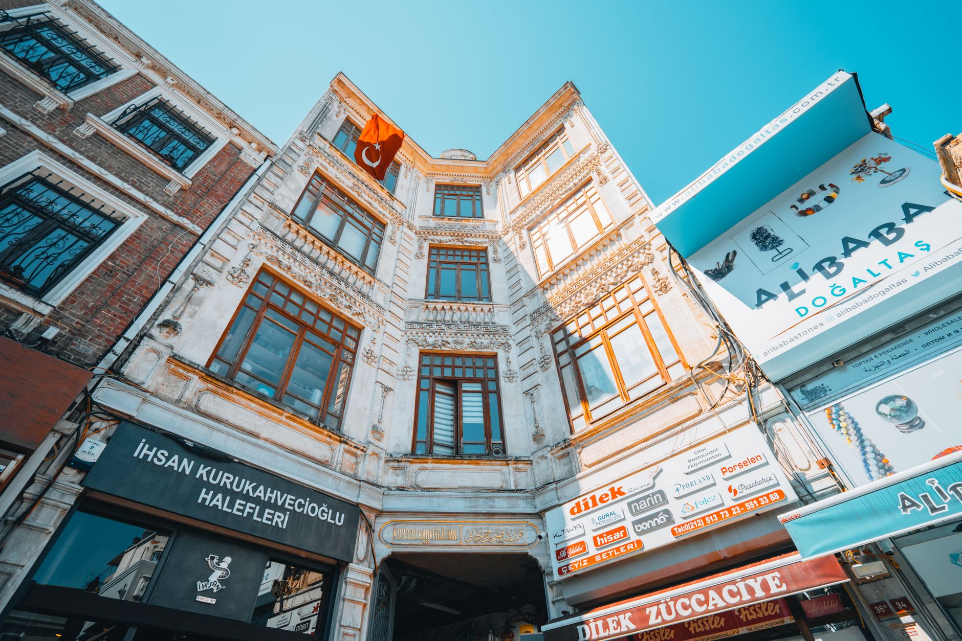 A vibrant low angle view of a historical Turkish building facade on a sunny day.