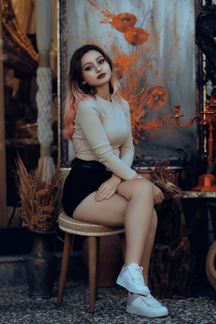 Beautiful Woman Sitting On A Stool