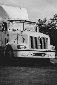 Monochrome photo of a parked cargo truck in the Philippines, capturing its vintage appeal.
