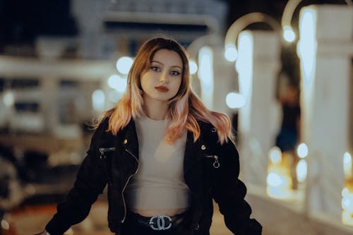 A Woman in Black Jacket Looking with a Serious Face