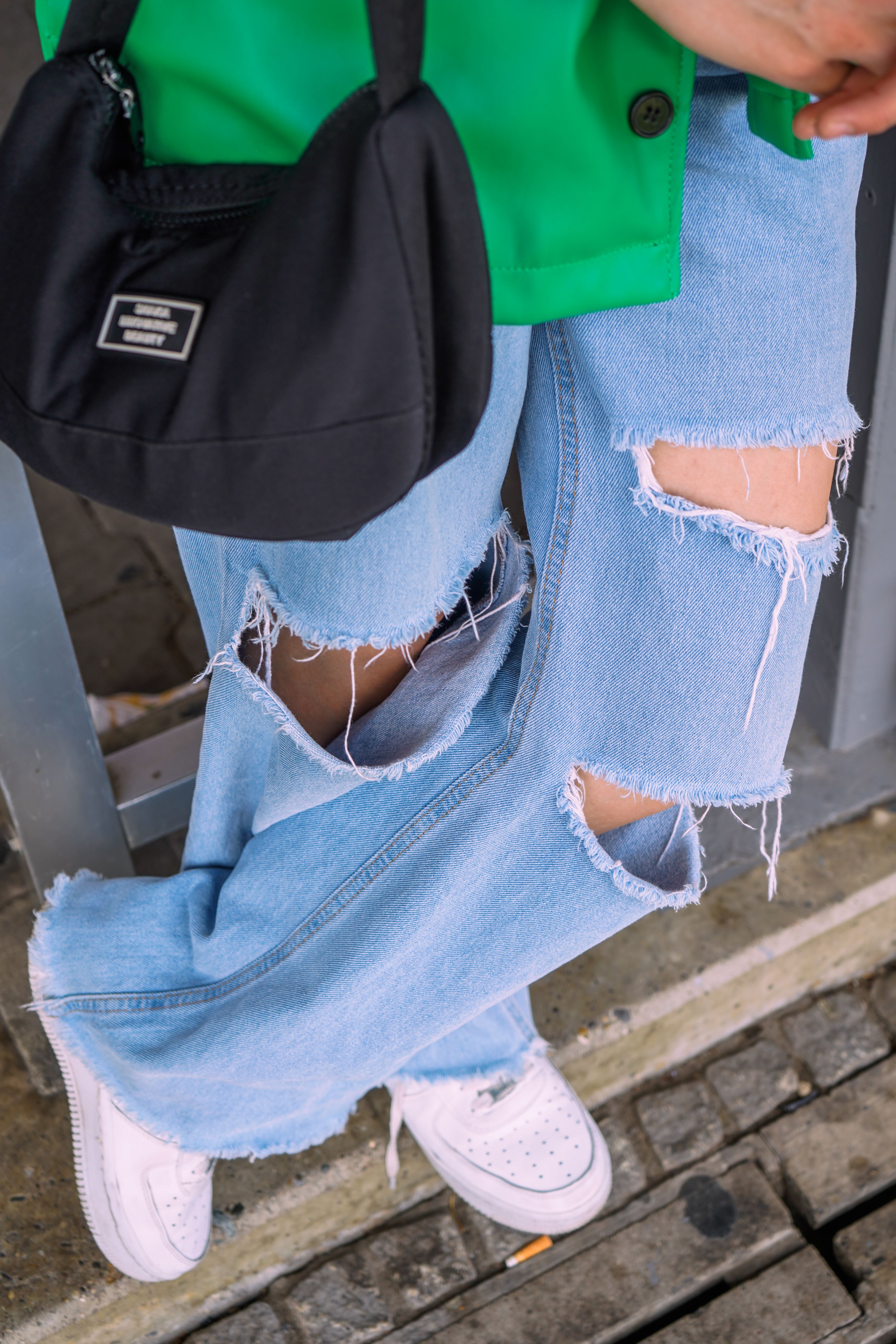 A Person Wearing Ripped Jeans · Free Stock Photo