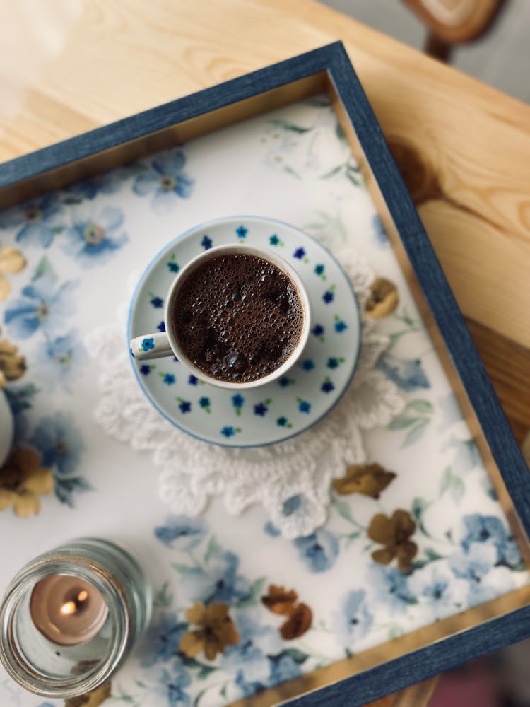 A Cup Of Coffee On The Tray