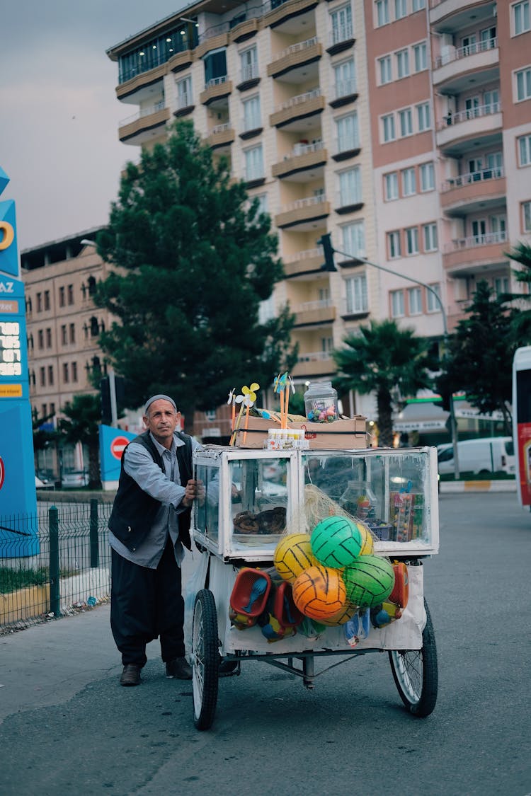 Man Pushing A Cart Stall