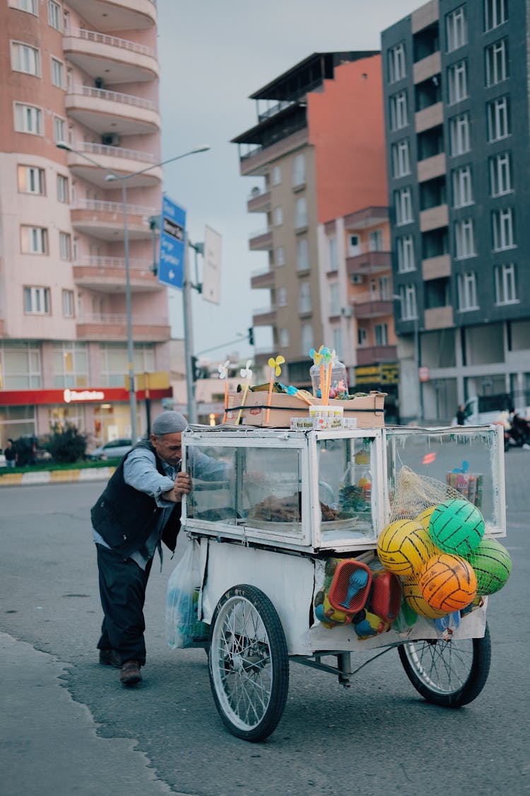 Man Pushing A Food Cart