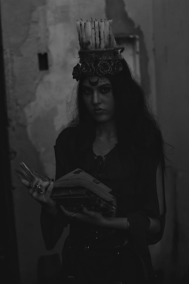 Woman In Witch Costume With Book