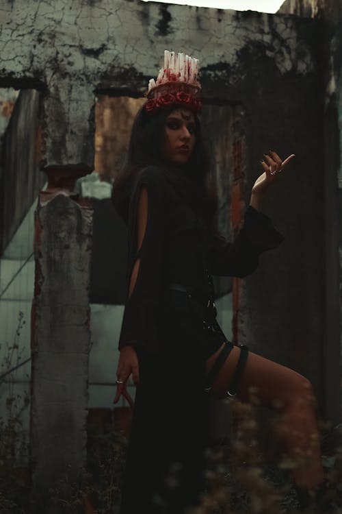 Dark Photo of a Woman Wearing a Candle Crown