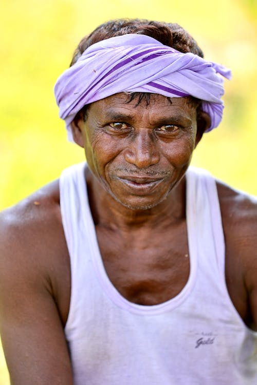 A Man Wearing a White Tank Top