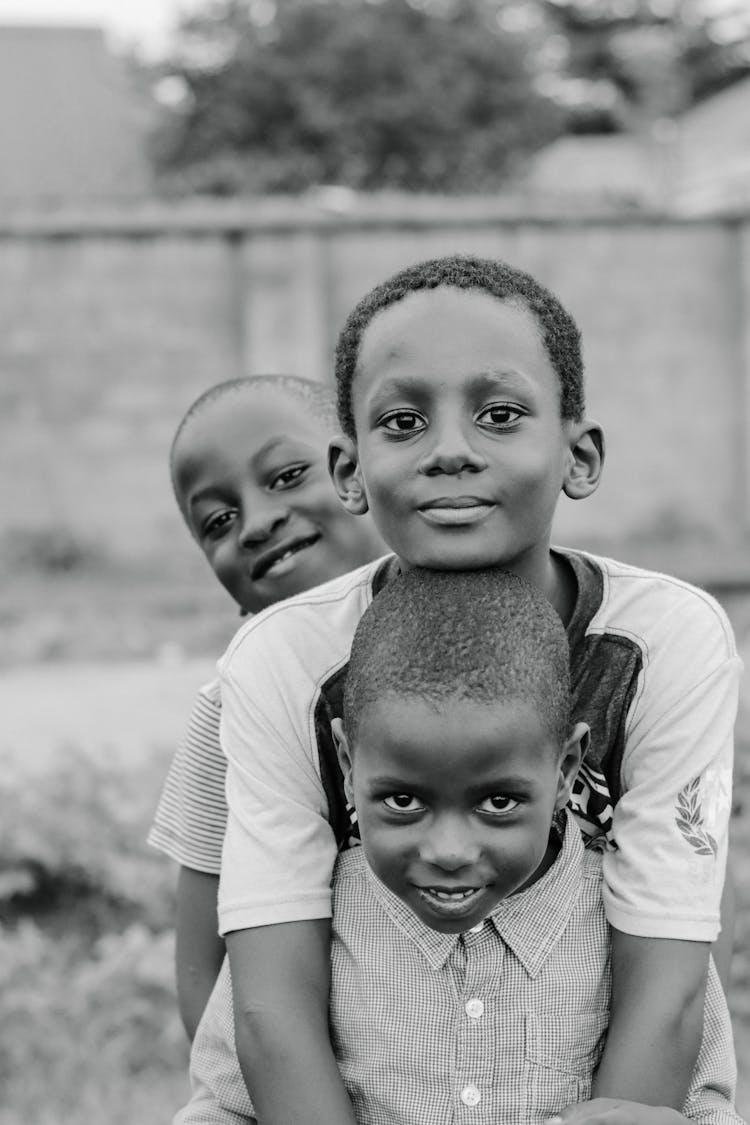 Grayscale Photo Of Boys 