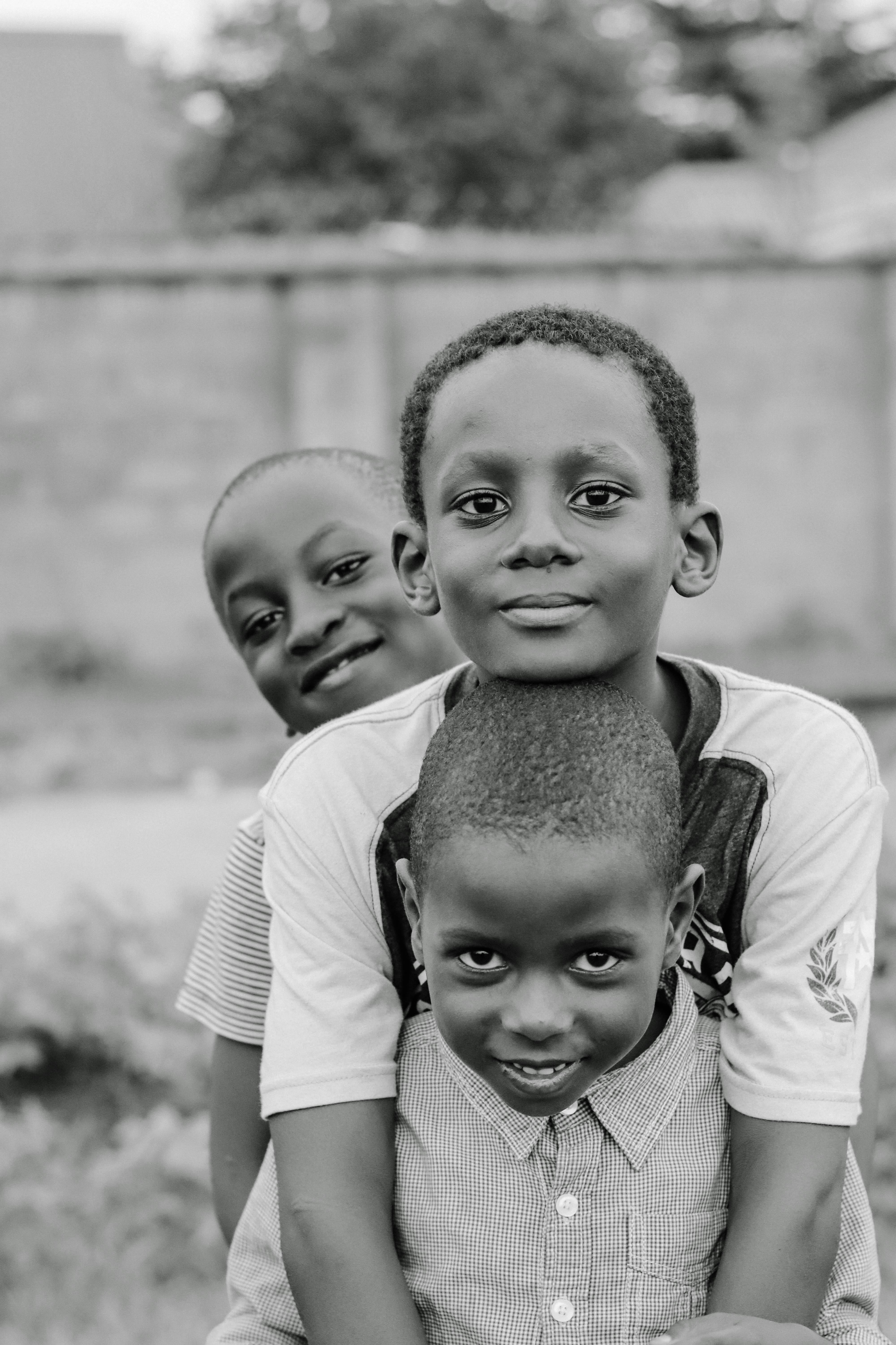 A Boy Carrying his Younger Brother · Free Stock Photo