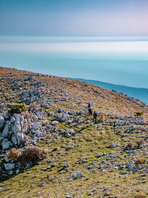 Hikers Walking on Mountain Top