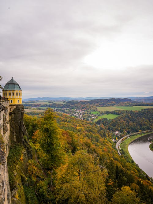 Fortress on the Cliff with a View of a River and Forest 