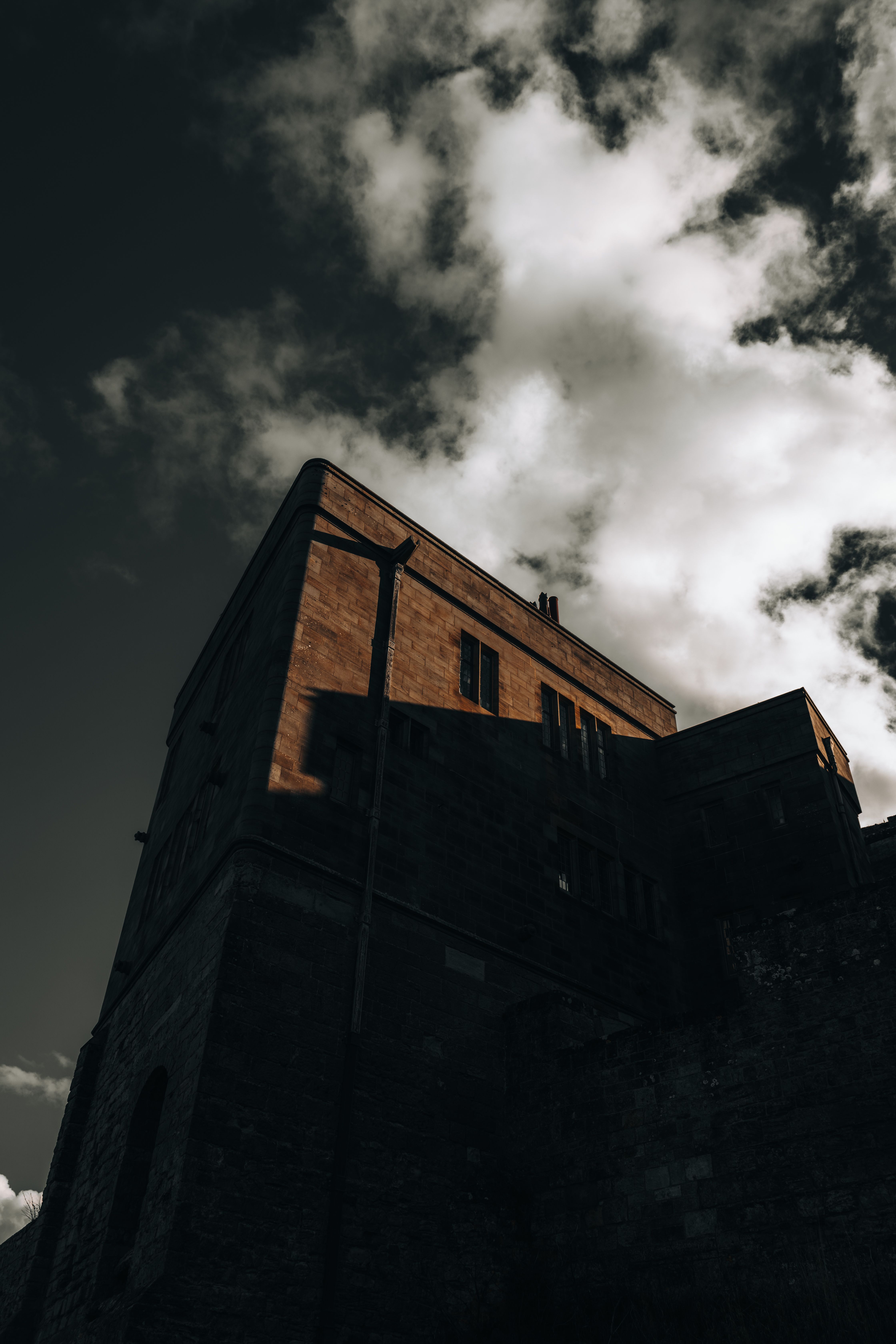 A Low Angle Shot of a Concrete Building Under the Cloudy Sky · Free ...