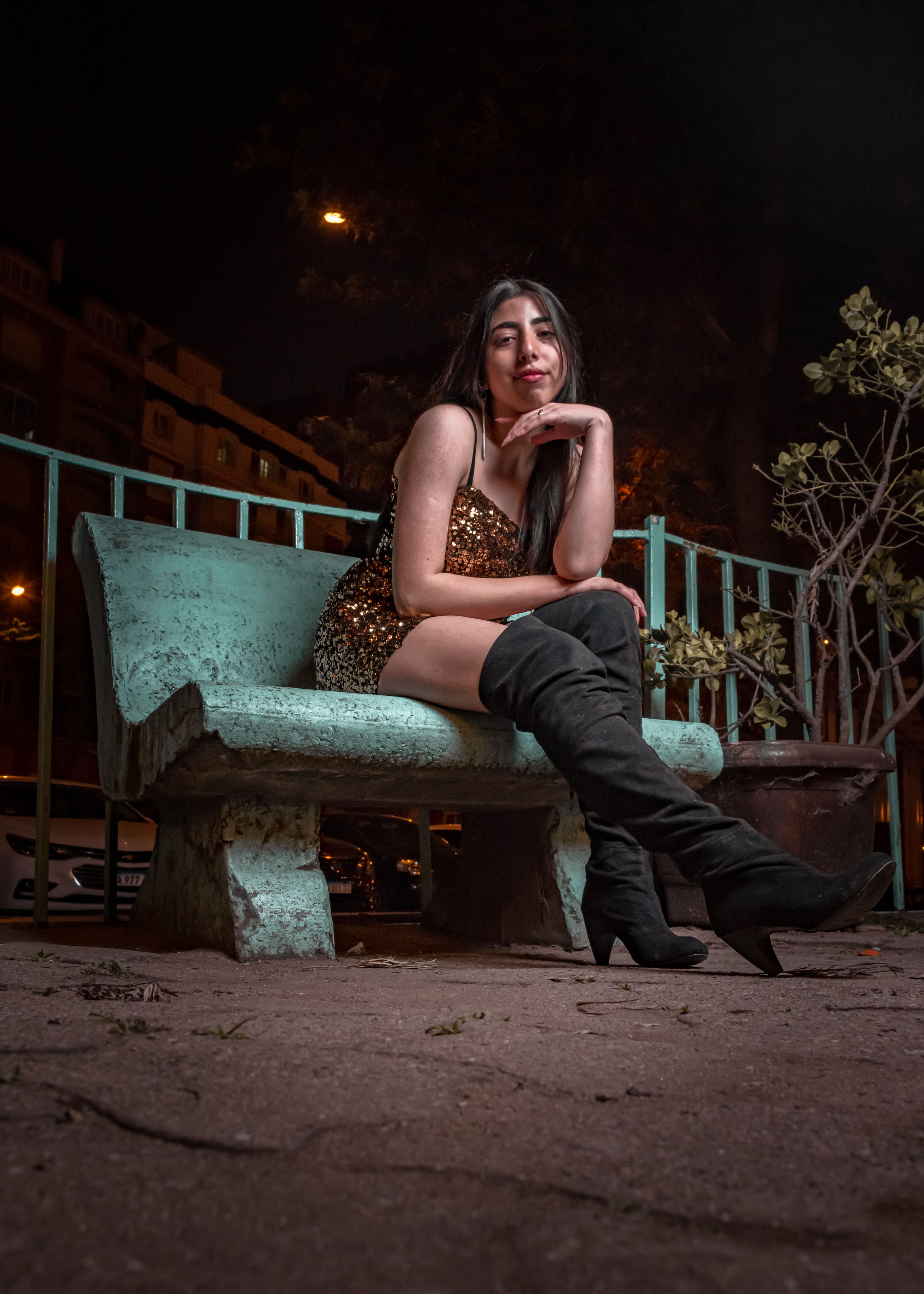 A Woman Sitting on Concrete Bench · Free Stock Photo