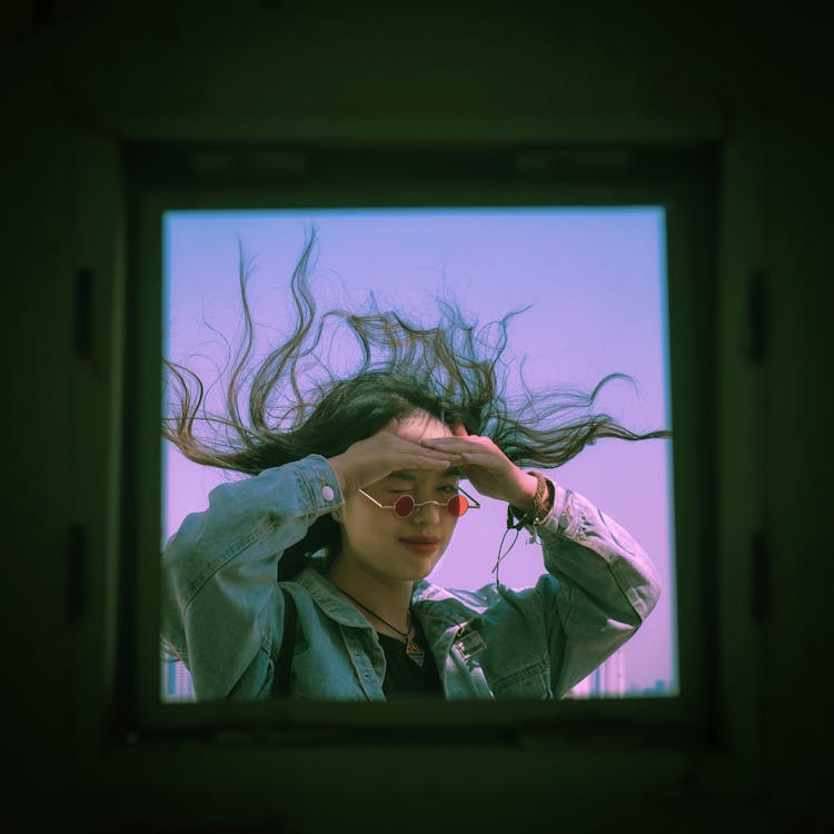 Woman Face With Hair Swaying On Wind