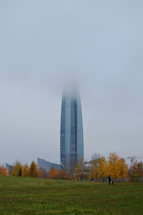 Modern High Rise Building on Grass Field