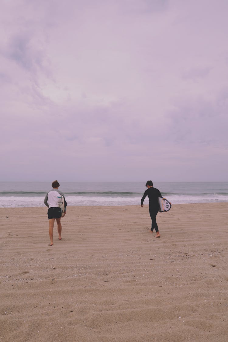 Surfers At The Beach