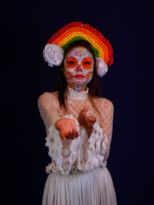 Catrina in a White Dress and a Colorful Headdress