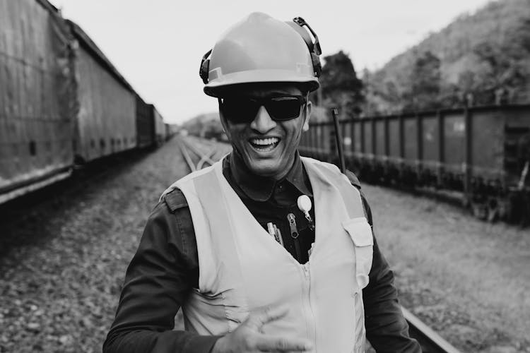 Monochrome Portrait Of A Smiling Railroad Worker 