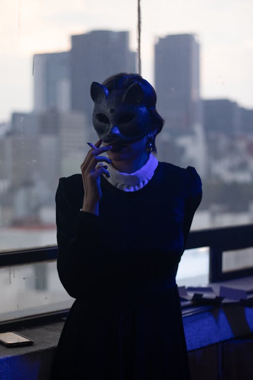 A Woman Wearing Black Cat Mask